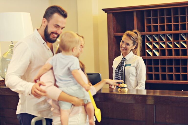 Satisfied hotel guests at the reception desk